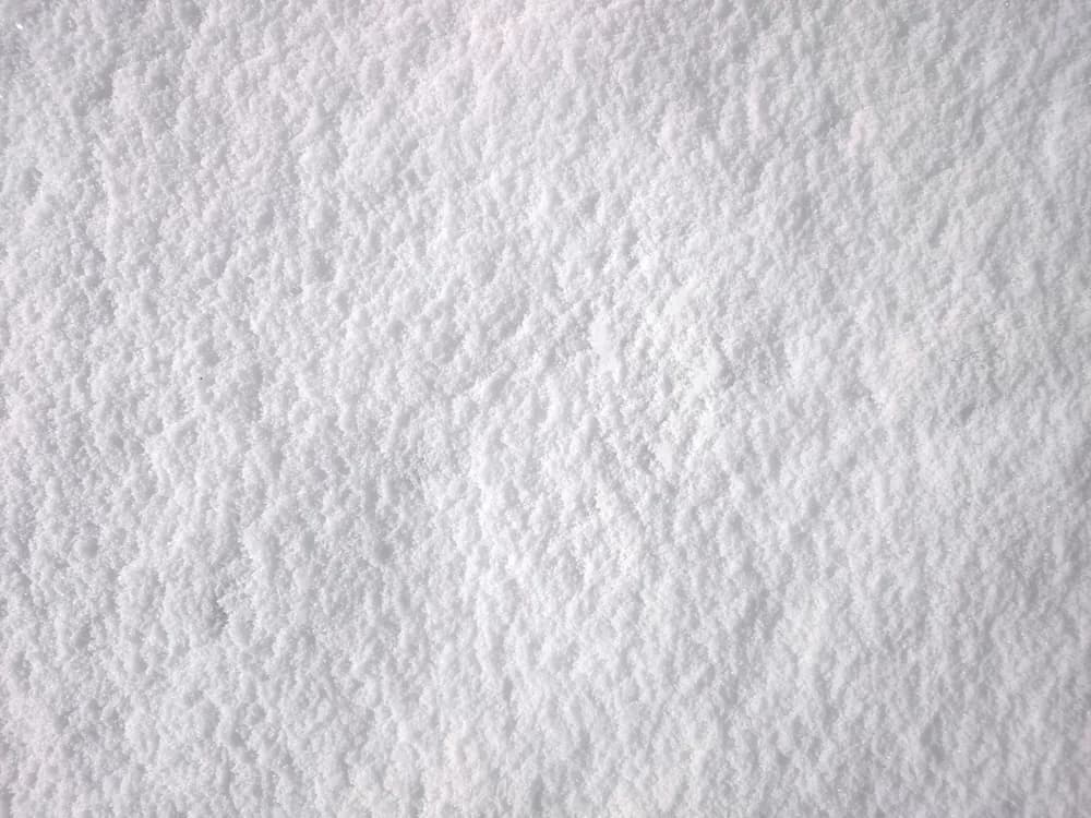 A close-up of fine white calcium carbonate powder.